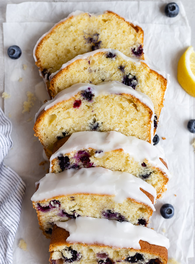 slices of lemon blueberry pound cake on parchment paper