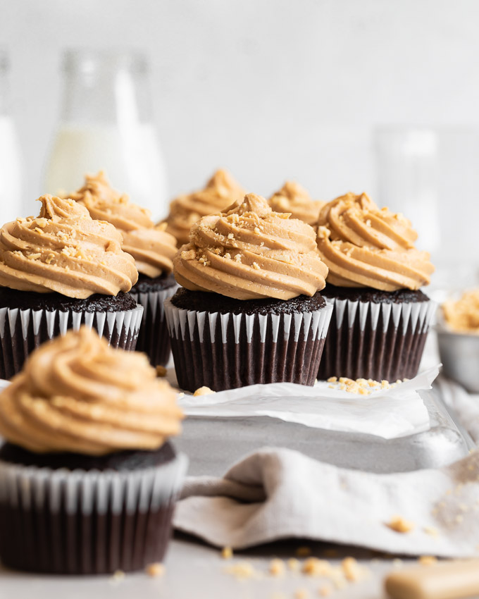 dark chocolate cupcakes with peanut butter frosting on platter