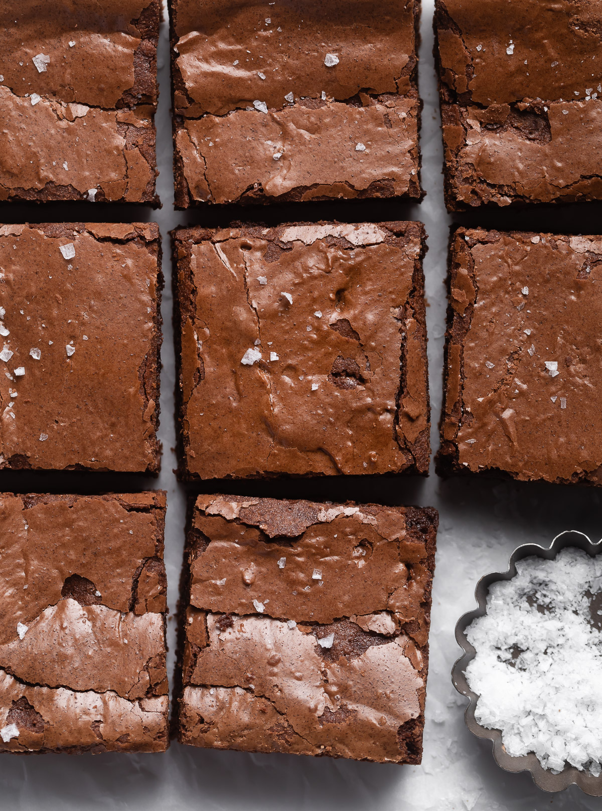 close up of sliced browned butter brownies sprinkled with sea salt